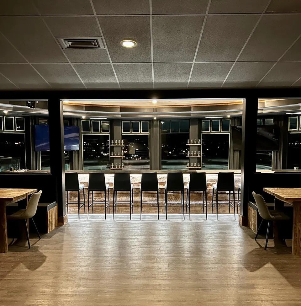 Dining room and bar at Lone Oak Fox Meadow with full-height windows