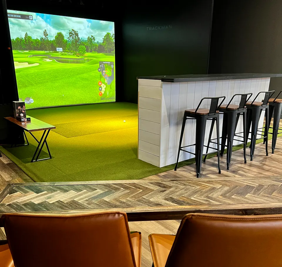 Trackman golf simulator screen and hitting bay at Lone Oak in Borden-Carleton